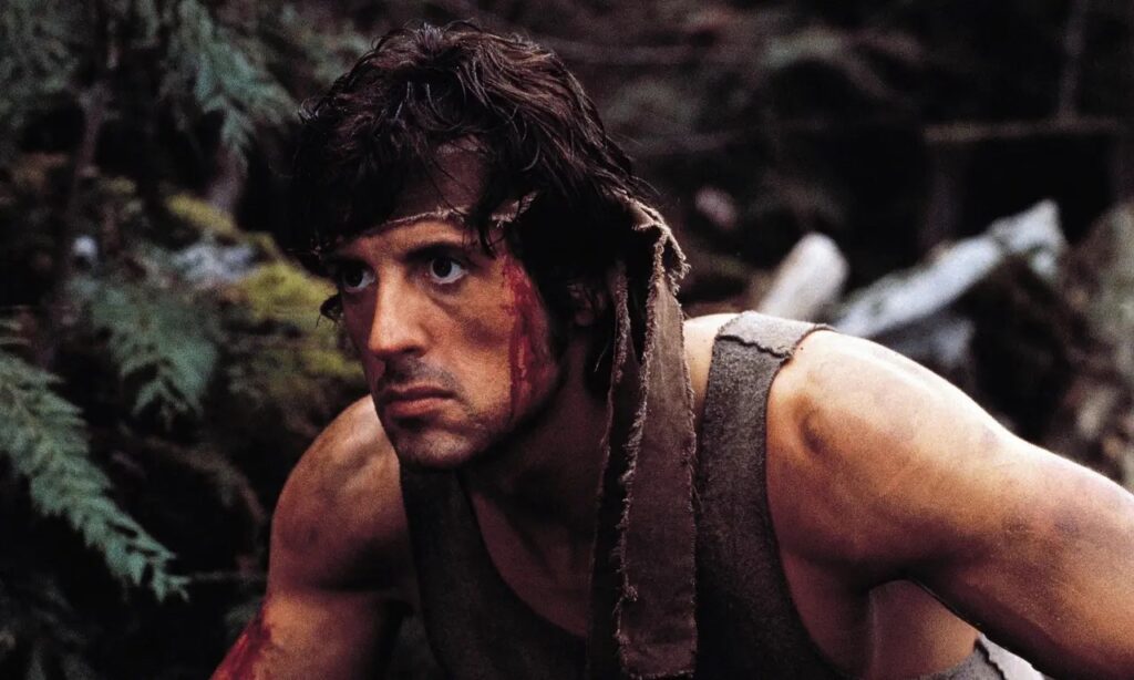 John J. Rambo (Sylvester Stallone) hiding in the woods in 'First Blood'