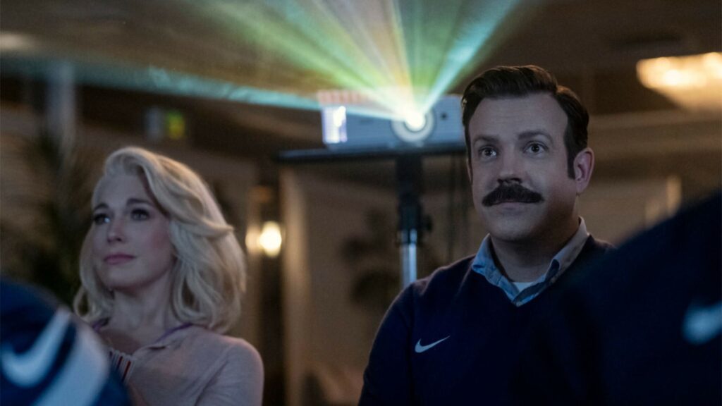 Ted (Jason Sudeikis) watching a film with the soccer team in 'Ted Lasso'