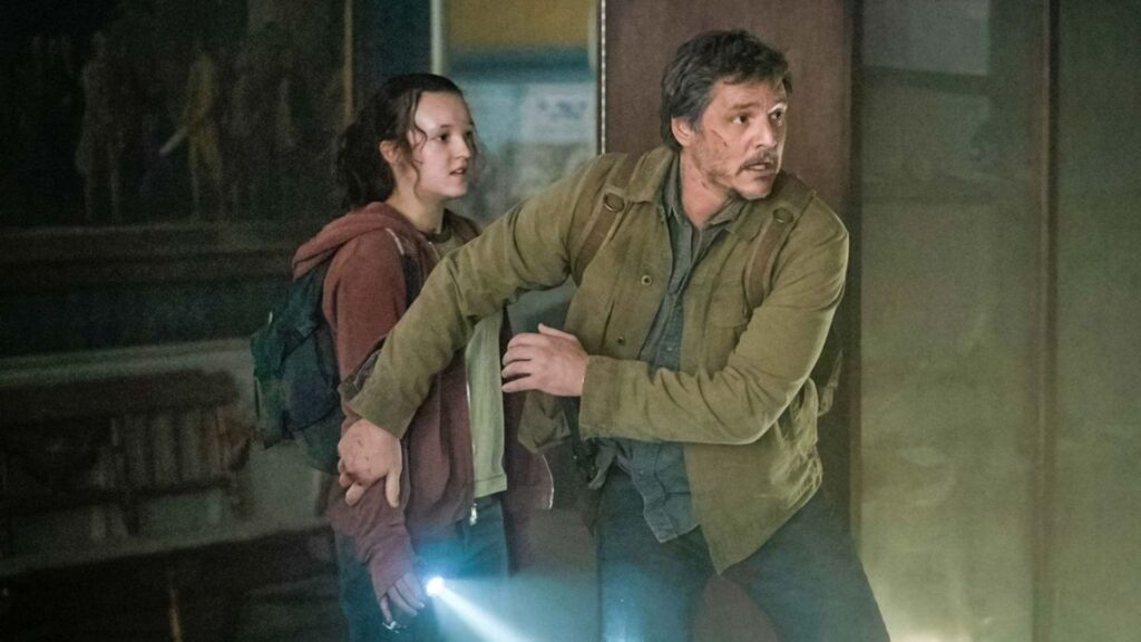 Joel (Pedro Pascal) protecting Ellie (Bella Ramsey) in 'The Last of Us'