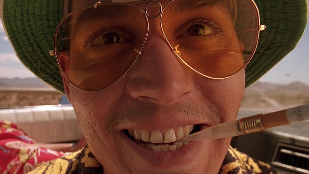 A close-up of Raoul Duke (Johnny Depp) in a car in the desert in 'Fear and Loathing in Las Vegas'
