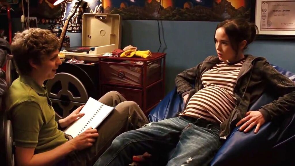 Juno (Eliot Page) and Paulie (Michael Cera) talking on the floor of his room in 'Juno,' 5 Trademarks of a Diablo Cody Script