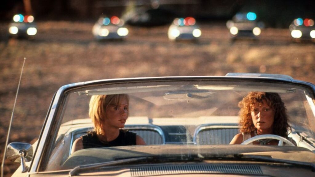 Louise, played by Susan Sarandon, and Thelma, played by Geena Davis, driving away from the police in ‘Thelma & Louise,' 100 Prompts for Memorable Movie Endings