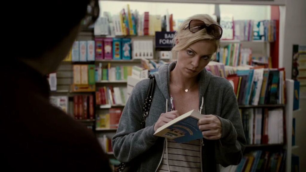 Mavis (Charlize Theron) signing a book in 'Young Adult'