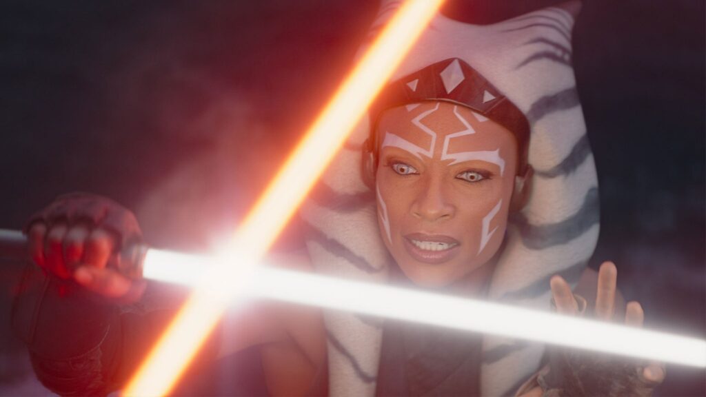 Ahsoka Tano (Rosario Dawson) using her lightsaber to block another lightsaber in 'Ahsoka'