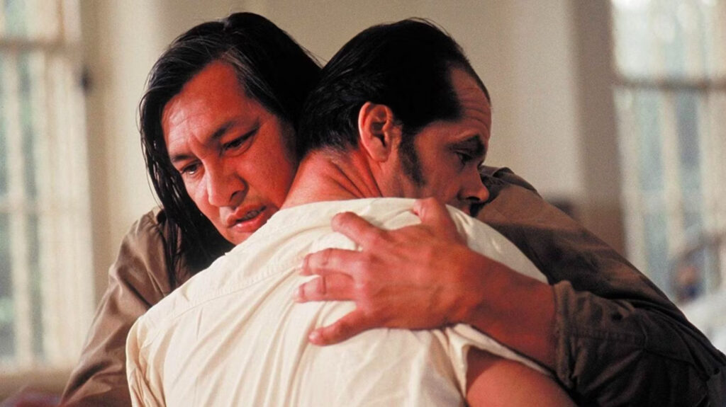 Randle, played by Jack Nicholson, being hugged by "Chief,” played by Will Sampson, in 'One Flew Over the Cuckoo's Nest,' 100 Prompts for Memorable Movie Endings