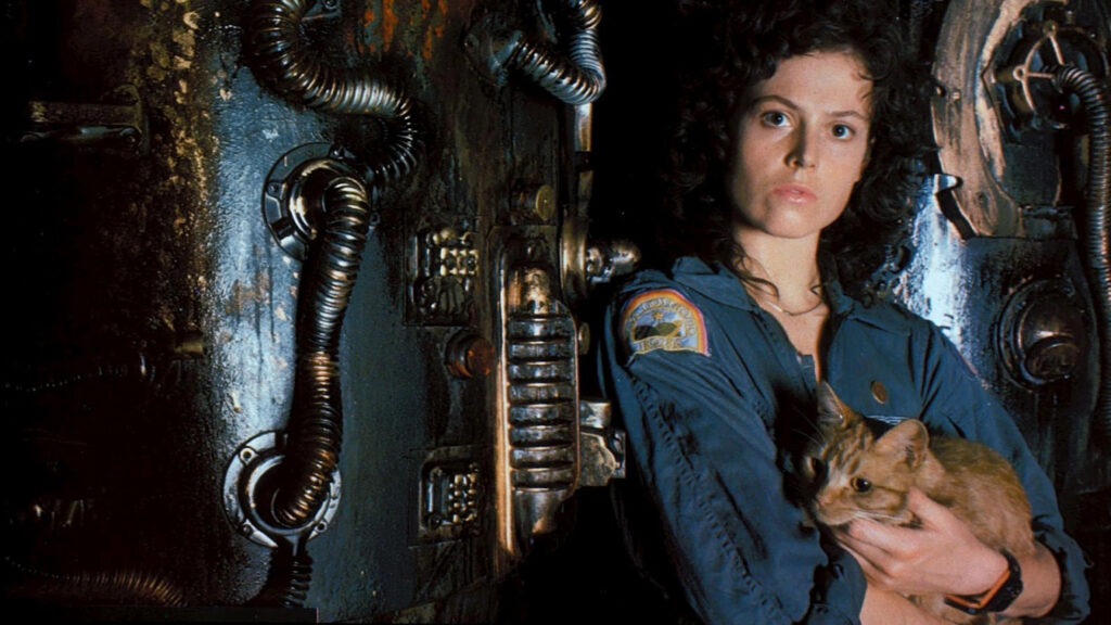 Ellen Ripley, played by Sigourney Weaver, holding a cat on a spaceship in 'Alien'