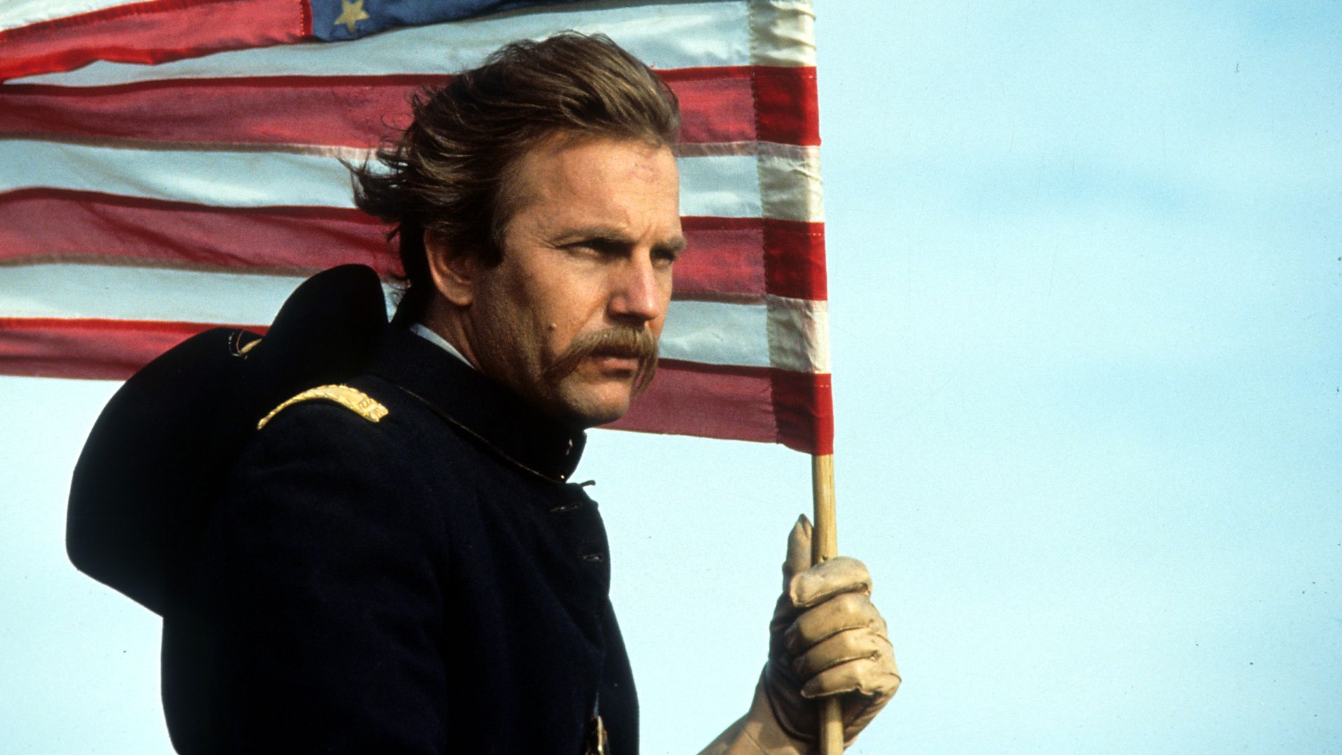 John J. Dunbar (Kevin Costner) holding an American flag in 'Dances with Wolves'