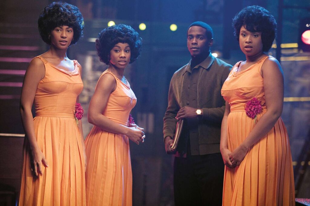 Deena Jones (Beyonce), Effie White (Jennifer Hudson), and Lorrell Robinson (Anika Noni Rose) in matching orange dresses in 'Dreamgirls'