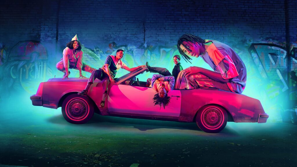 A pink car with four people and one giant sitting on it in 'I'm a Virgo,' 5 Insiders to Know if You Write Comedy