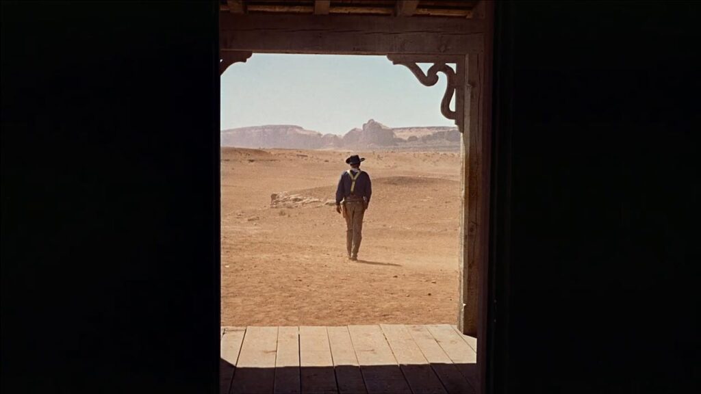 A man walking into the dusty plains in 'The Searchers'