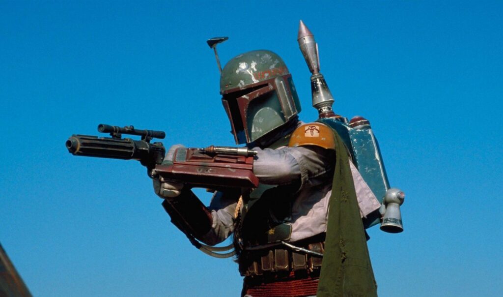 Boba Fett (Jeremy Bulloch) pointing his blaster in 'Star Wars: The Empire Strikes Back,' 10 Villain Archetypes Found in Movies and TV