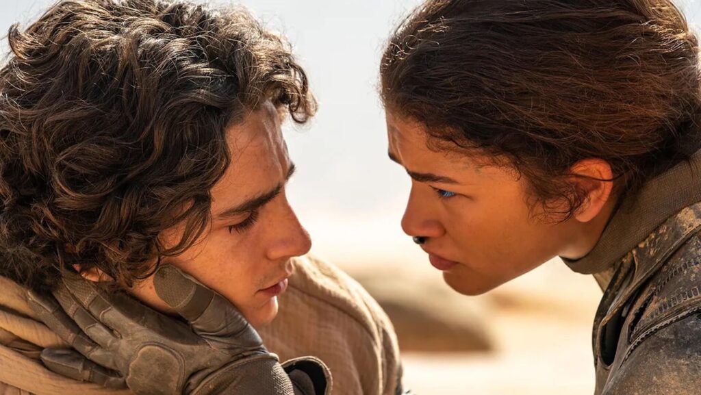 Paul (Timothée Chalamet) and Chani (Zendaya) looking longingly at each other in 'Dune: Part Two)