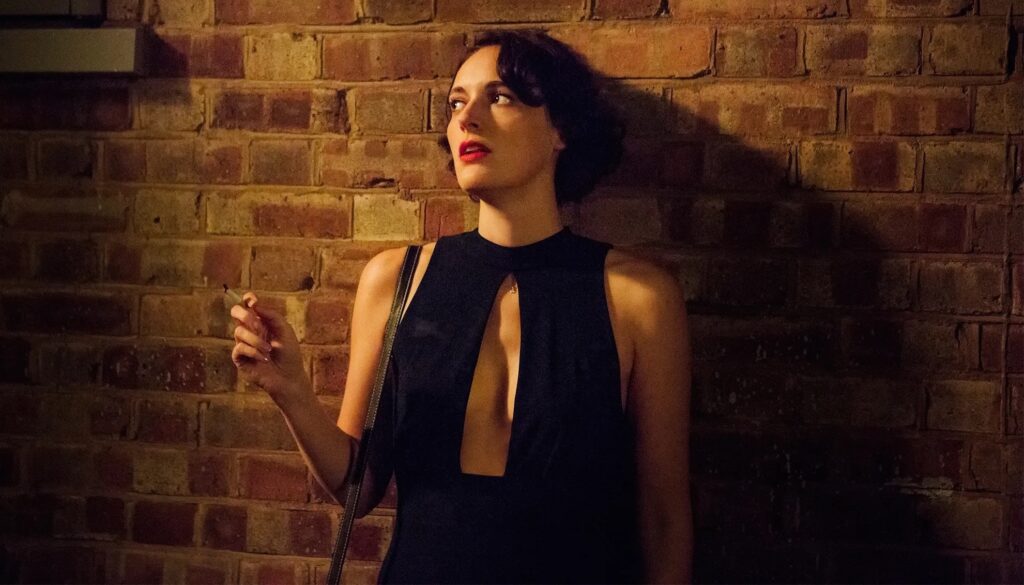 Fleabag (Phoebe Waller-Bridge) next to a brick wall in 'Fleabag'