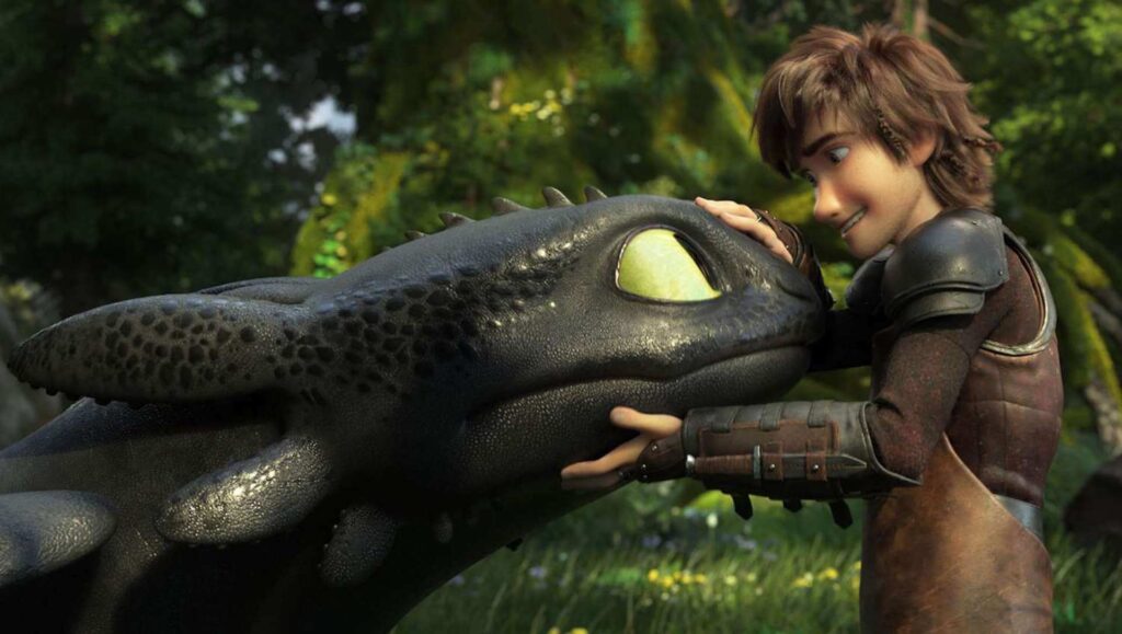 Hiccup petting Toothless' nose in 'How to Train Your Dragon'