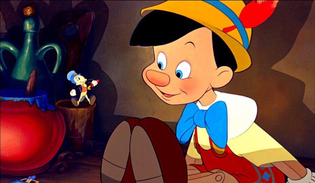 Jiminy Cricket giving Pinocchio advice in 'Pinocchio,' 10 Sidekick Character Archetypes in Movies and TV