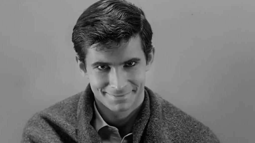 Norman Bates (Anthony Perkins) looking at the camera from his jail cell in 'Psycho'