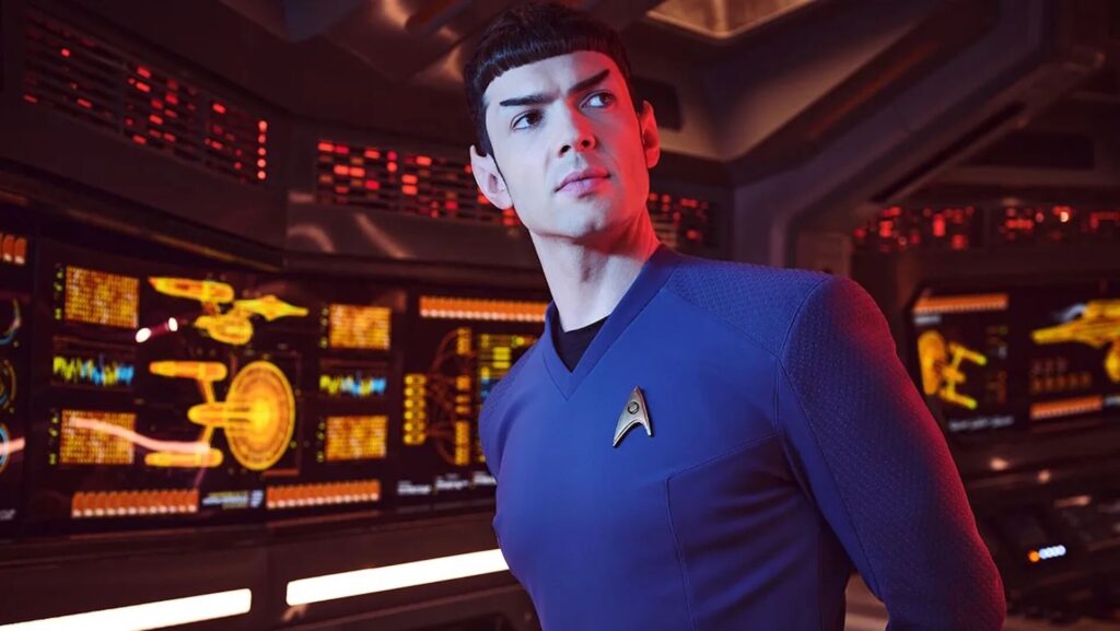 Spock (Ethan Peck) in a blue shirt standing in a spaceship in 'Star Trek: Strange New Worlds'