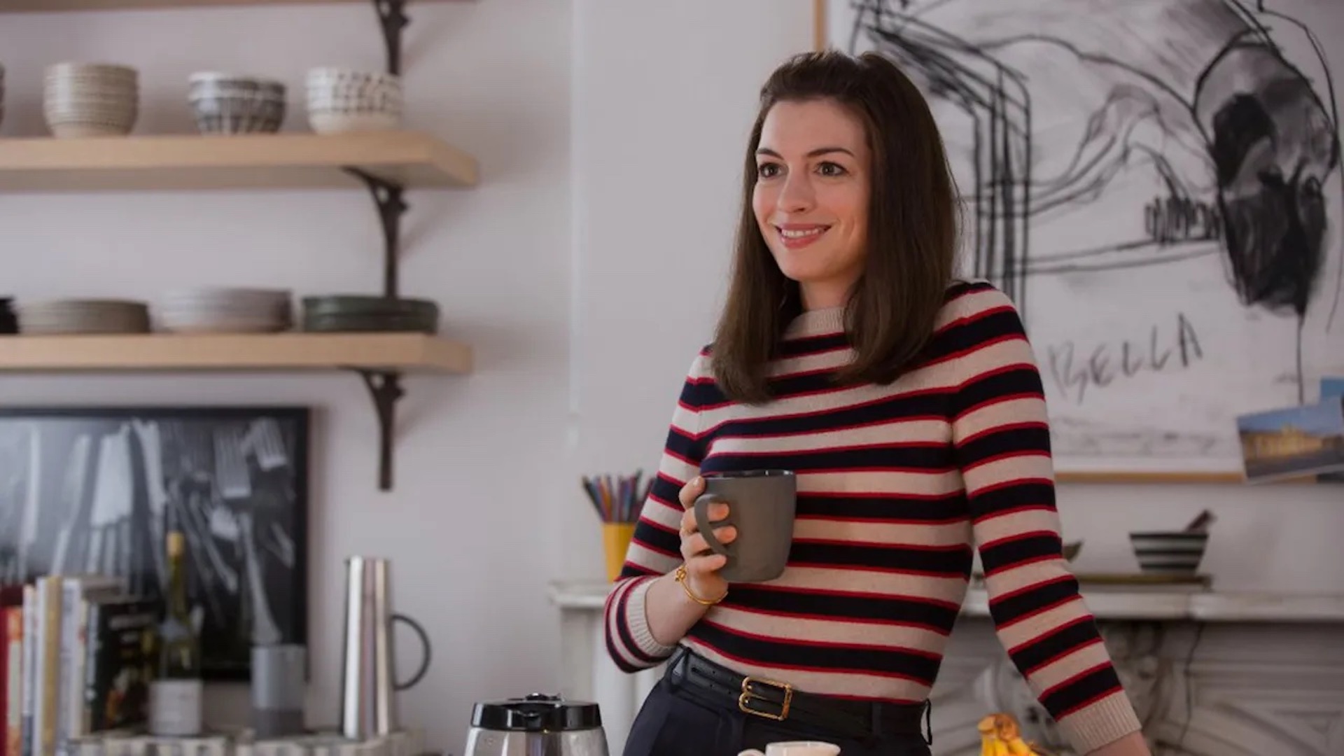 Jules (Anne Hathaway) drinking coffee in her kitchen in 'The Intern'