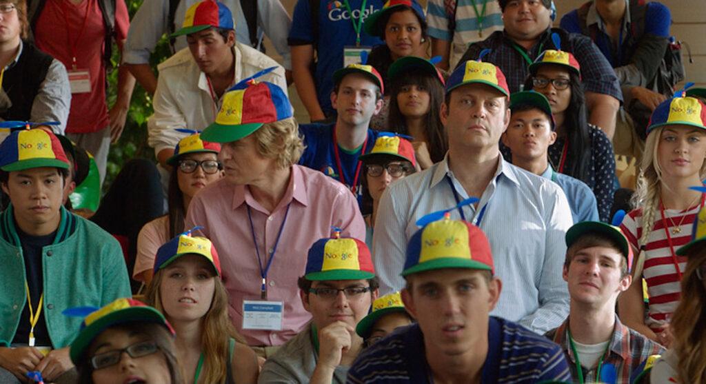 Billy McMahon (Vince Vaughn) and Nick Campbell (Owen Wilson) sitting with a group of interns in 'The Internship,' The Do’s and Don'ts of Writing Professional Script Coverage