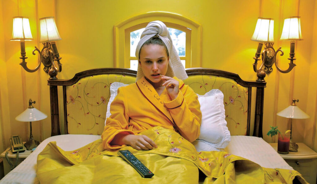 Natalie Portman in a yellow bed in ‘Hotel Chevalier’