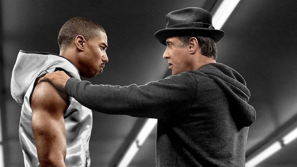 Rocky (Sylvester Stallone) giving Donnie Creed (Michael B. Jordan) advice in the gym in 'Creed'