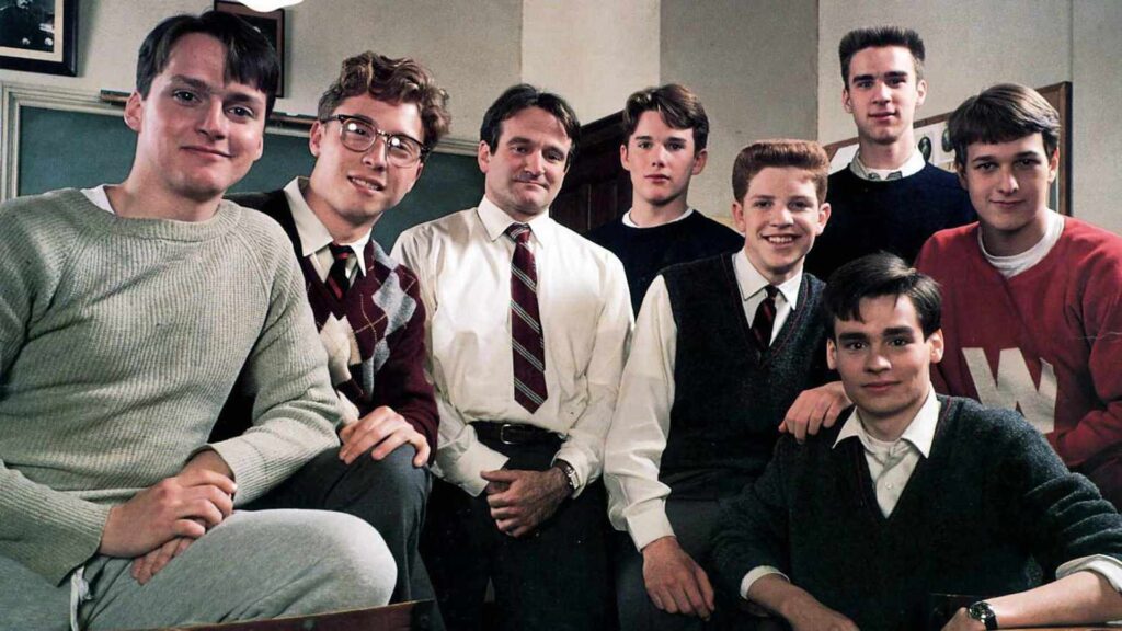 The cast of 'Dead Poets Society' sitting in a classroom, The Importance of Mentorship in Writing Careers