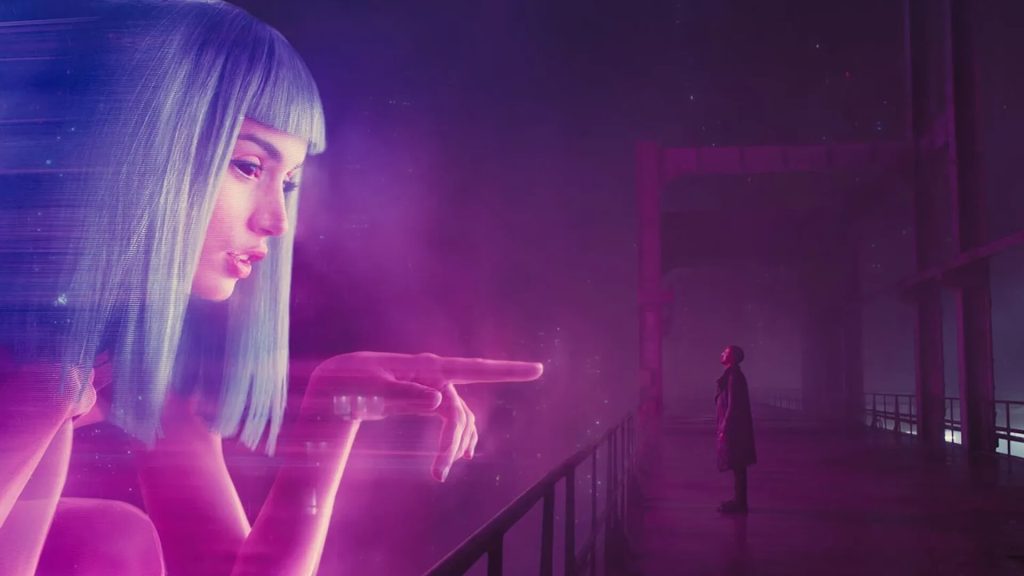 A large hologram woman talking to K (Ryan Gosling) in 'Blade Runner 2049'