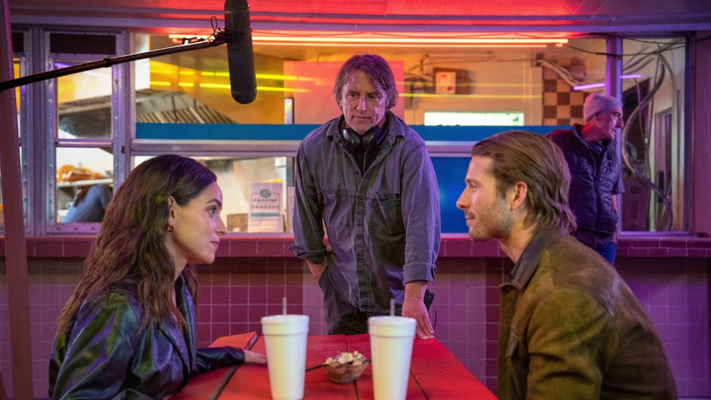 Richard Linklater directing Glen Powell and Adria Arjona on the set of 'Hit Man'