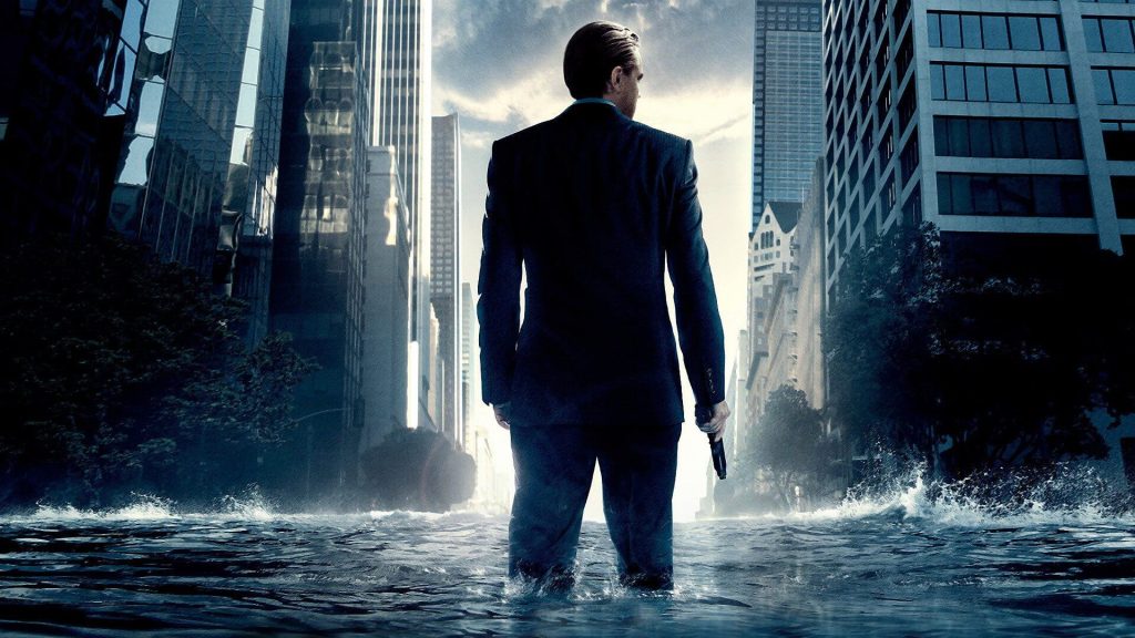 Dom Cobb (Leonardo DiCaprio) standing in water in a city in 'Inception'