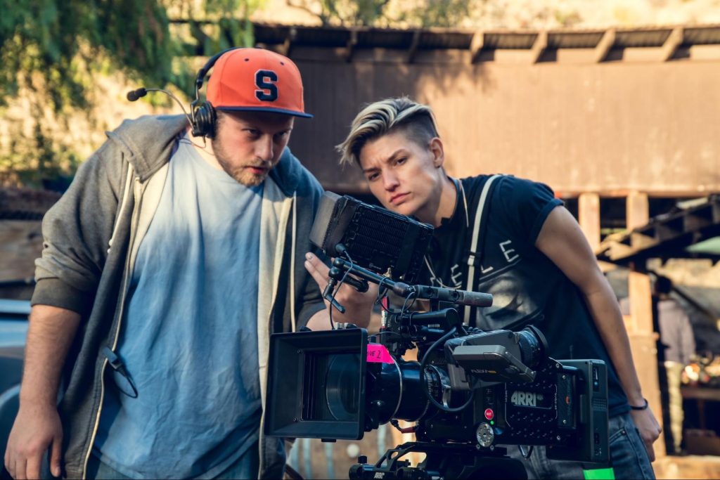 A director looking at a monitor on a film set