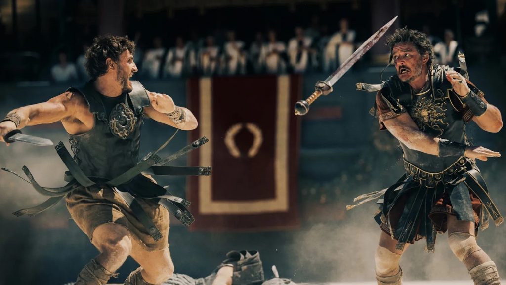 Lucius (Paul Mescal) and General Marcus Acacius (Pedro Pascal) fighting in 'Gladiator II'