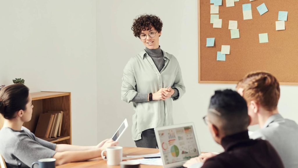 Woman Wearing Gray Cardigan and Eyeglasses, What You Need to Bring to a Pitch Meeting