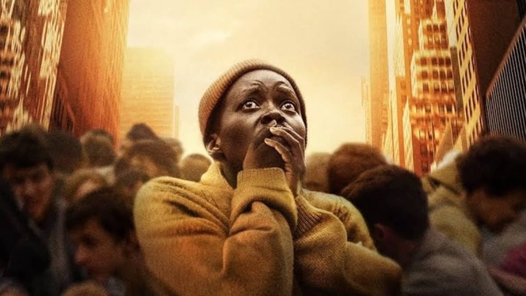 Samira (Lupita Nyong'o) holding her hands over her mouth in 'A Quiet Place: Day One,' Script Apart: How 'A Quiet Place: Day One' Screenwriter Michael Sarnoski Creates a Strong and Simple Logline
