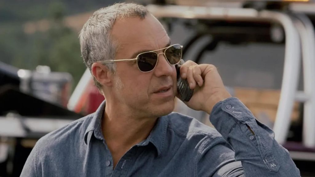 Hieronymus "Harry" Bosch (Titus Welliver) on the phone at a crime scene in 'Bosch'