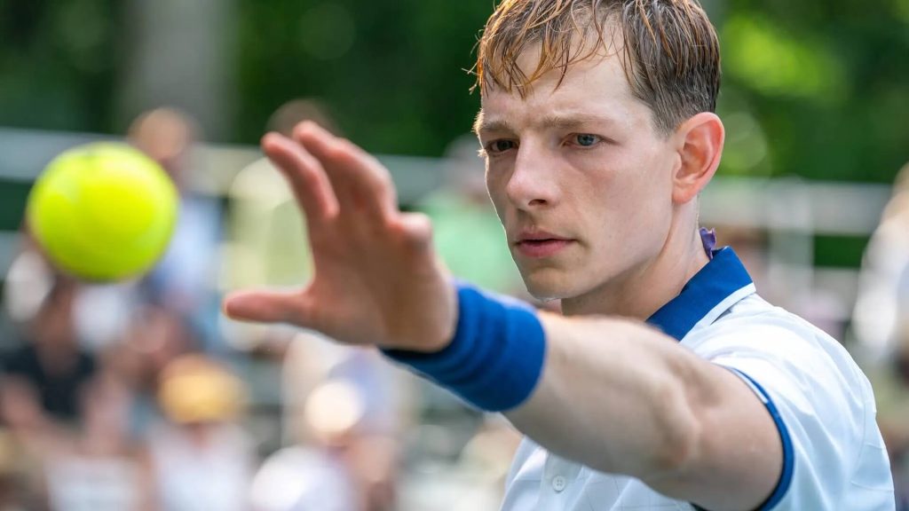 Art (Mike Faist) catching a tennis ball