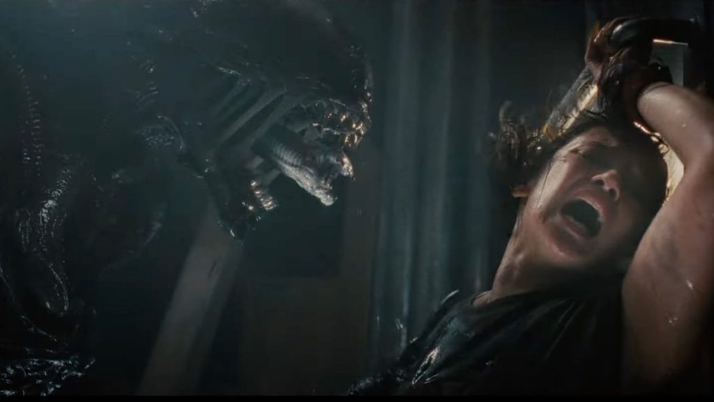 A Xenomorph screaming at Rain (Cailee Spaeny) in 'Alien: Romulus'