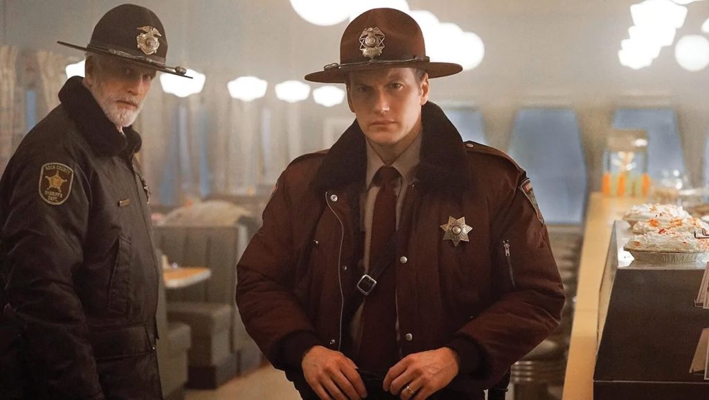 Two cops stand next to a pie display in a dinner in 'Fargo'