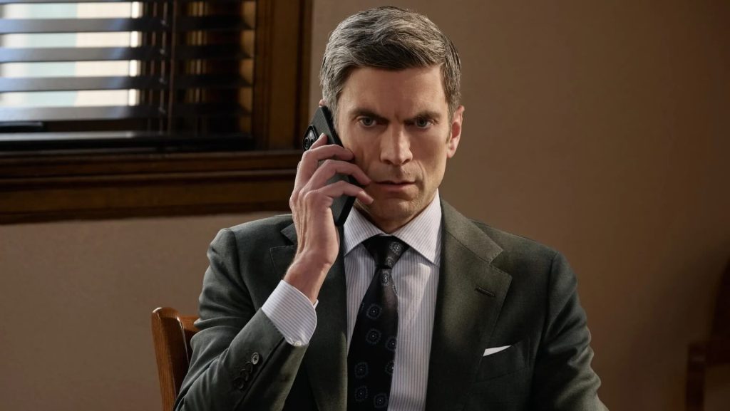 Jamie Dutton (Wes Bentley) talking on a cellphone.