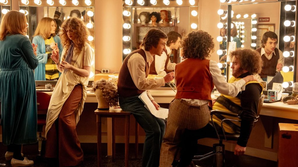 Lorne Michaels (Gabriel LaBelle) talking to John Belushi (Matt Wood) in a dressing room in 'Saturday Night.'