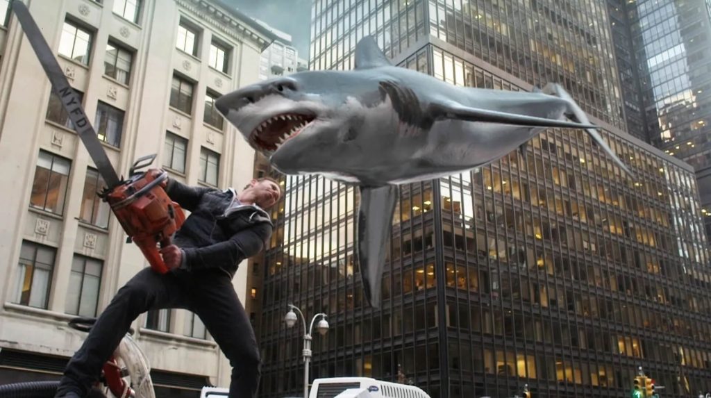 A man with a chainsaw fights a flying shark in New York City in 'Sharknado 2: The Second One' (2014)