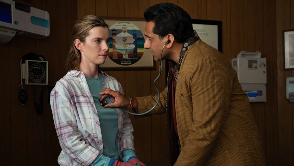 Lina (Betty Gilpin) gets her heart checked by a doctor in 'Three Women'